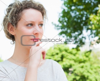 beautiful young attractive woman outdoors portrait of thinking w