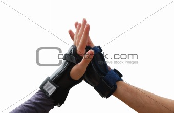 Teen arms in roller wrist guards salutation isolated