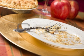 Apple Pie, Empty Plate with Remaining Crumbs and Fork.