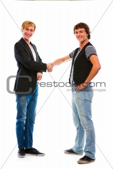 Two modern teenage boys shaking hands. Isolated on white
