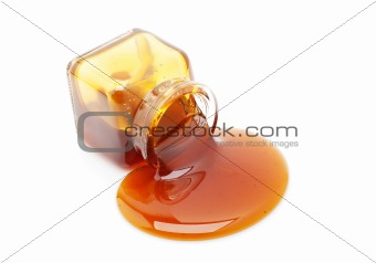 Honey spill from a glass jar