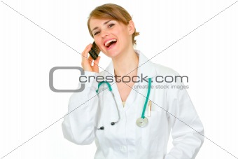 Smiling medical female doctor talking phone
