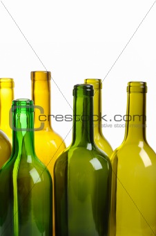 Many empty green wine bottles isolated on white background