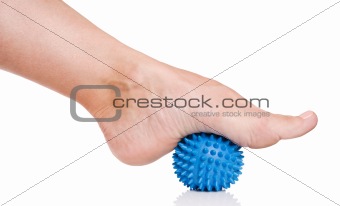Woman's foot with massage ball