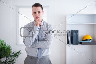 Businessman thinking and standing