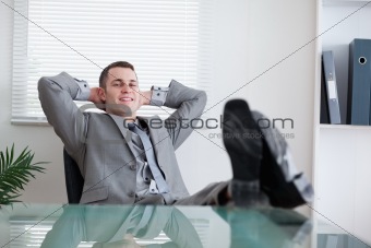 Happy businessman taking a rest