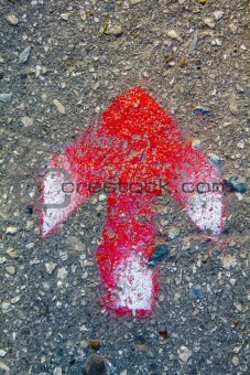 red arrow on asphalt
