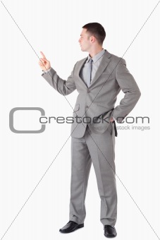 Portrait of a businessman pointing at something