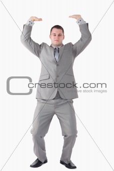 Portrait of a businessman pushing the roof