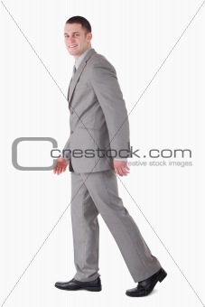 Portrait of a smiling businessman walking