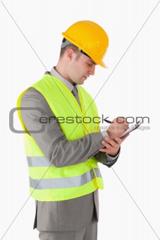 Portrait of a builder taking notes