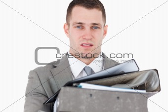 Overwhelmed young businessman
