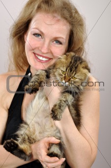 happy woman with a kitten