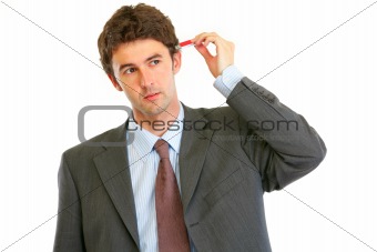Modern businessman trying to plug usb flash in head
