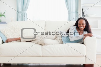 Woman lying on sofa