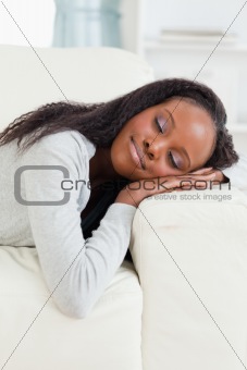 Woman lying on the sofa with eyes closed