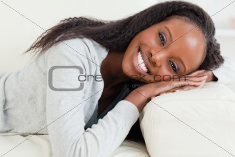 Close up of woman resting on sofa