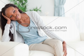 Close up of woman on sofa in thoughts
