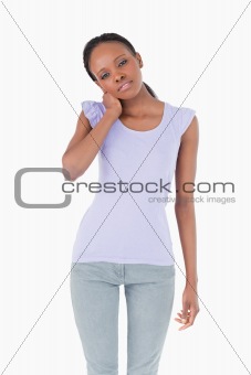 Close up of woman holding her neck on white background
