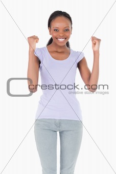 Close up of woman celebrating success on white background