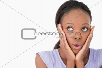 Close up of woman being afraid against a white background