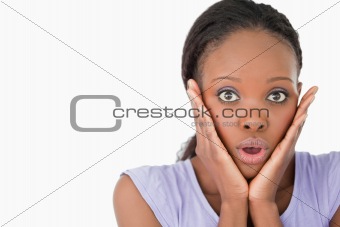 Close up of frightened woman on white background