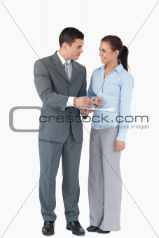 Business partner analyzing data against a white background
