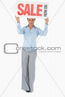 Businesswoman holding sign above her head