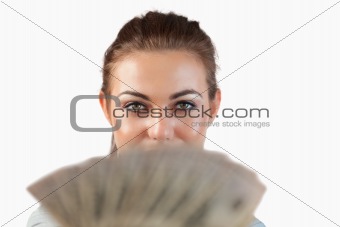 Close up of businesswoman showing bank notes