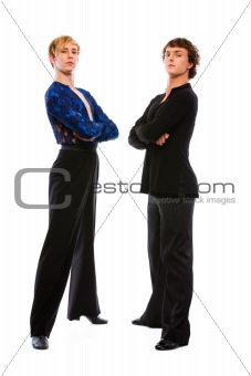 Two ballroom male dancers with crossed arms on white background 
