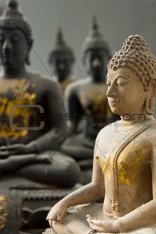 One White Stone Buddha and Three Black statue