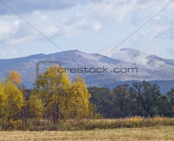 The first snow on slopes of mountains