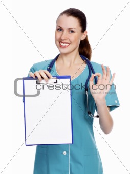 Smiling female doctor holding a clipboard against white backgrou