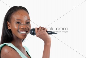 Happy smiling woman with microphone
