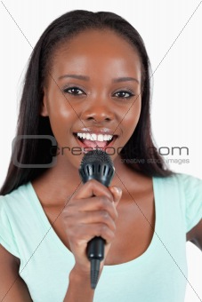 Close up of brightly smiling female singer