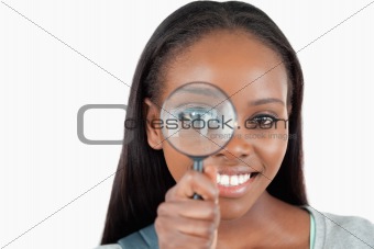 Young woman with magnifier