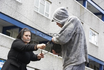 Man Mugging Woman In Street