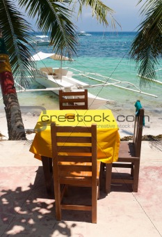 table under palm tree