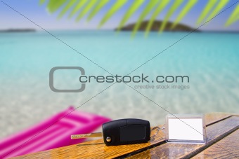 Car rental keys on wood table in vacation Caribbean