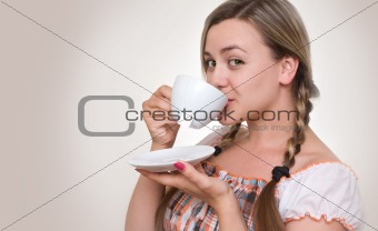 girl drinking tea from  cup.