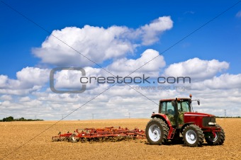 Tractor in plowed field