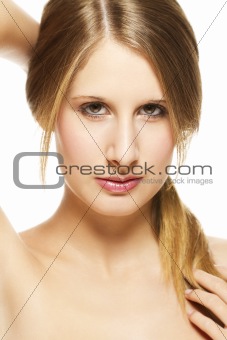 young beautiful woman holding her pigtail