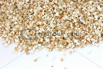 Scattered view of dry raw pealed buckwheat 