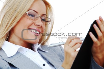 business woman hold a folder and write