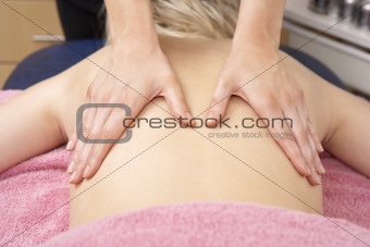 Close Up of female masseuse with client