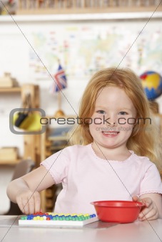 Young Girl Playing at Montessori/Pre-School