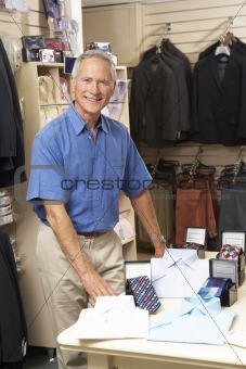 Male sales assistant in clothing store