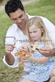 Father and Daughter Playing With Toy Airplanes
