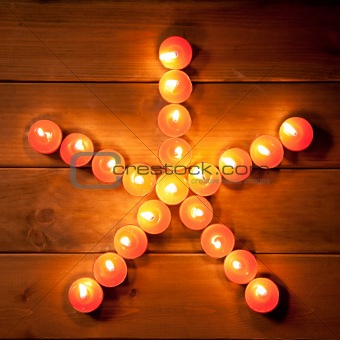 christmas candles pentagram star on wood