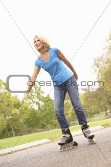 Senior Woman Skating In Park